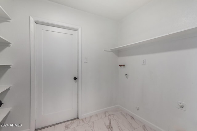 laundry area featuring gas dryer hookup and hookup for an electric dryer