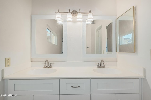 full bath with double vanity and a sink