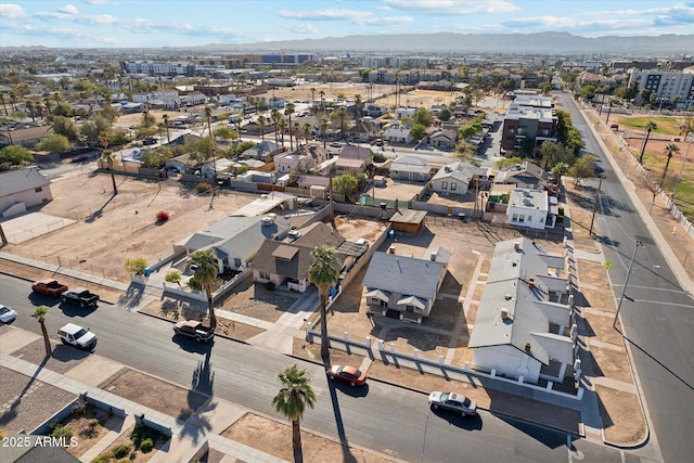 birds eye view of property featuring a mountain view