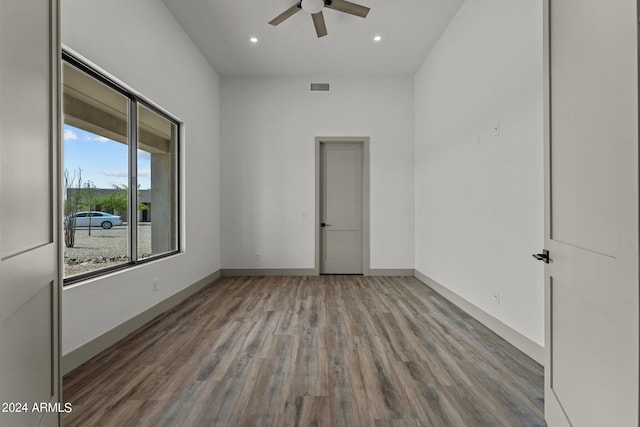 unfurnished room featuring ceiling fan and hardwood / wood-style flooring