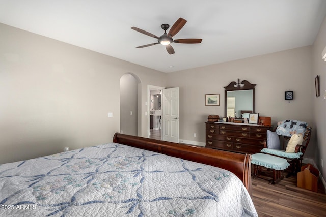 bedroom with ceiling fan and wood-type flooring