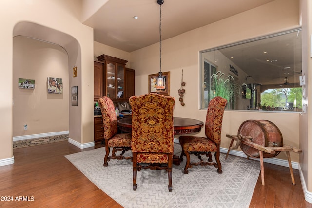 dining space with hardwood / wood-style floors