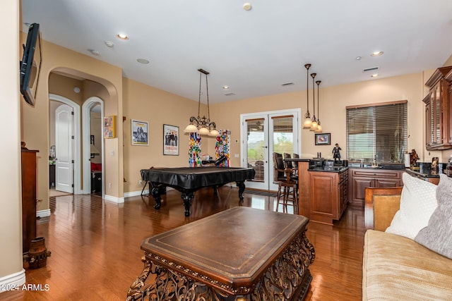 living area with pool table, recessed lighting, dark wood-style floors, and arched walkways