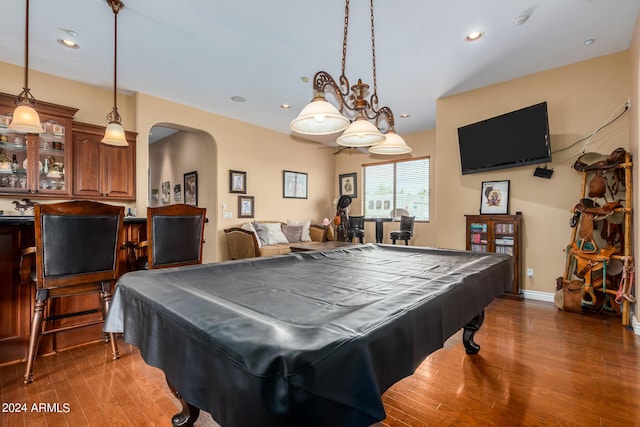 recreation room featuring baseboards, recessed lighting, wood finished floors, arched walkways, and billiards