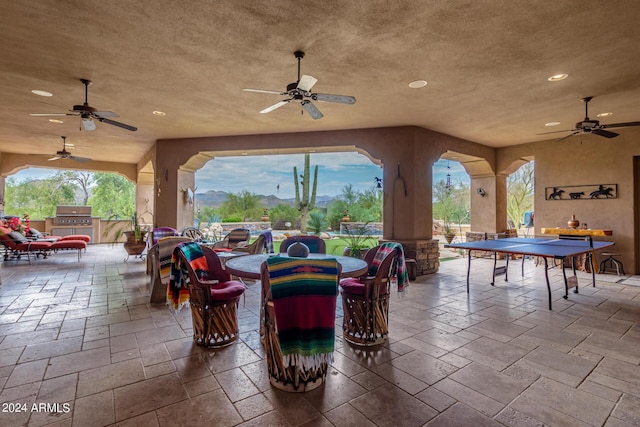 view of patio with outdoor dining space and grilling area