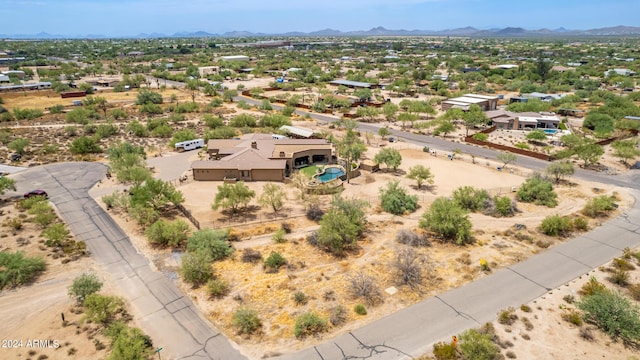 birds eye view of property with a mountain view