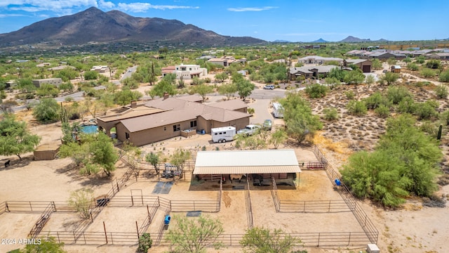 birds eye view of property featuring a mountain view and a rural view