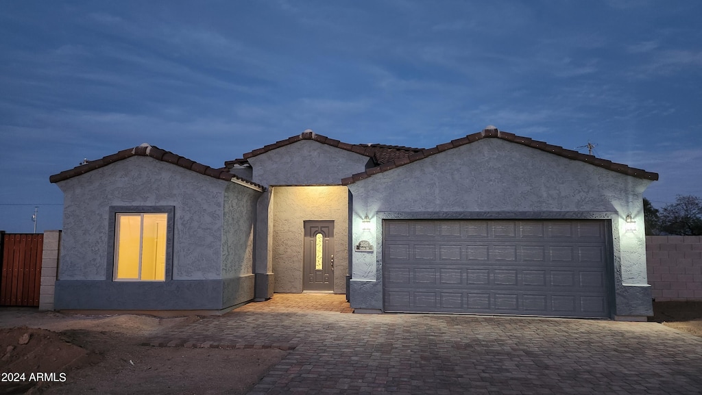 view of front of property with a garage