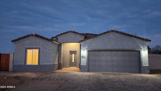 view of front of property with a garage