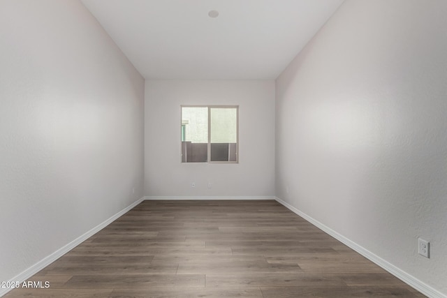 empty room featuring hardwood / wood-style flooring