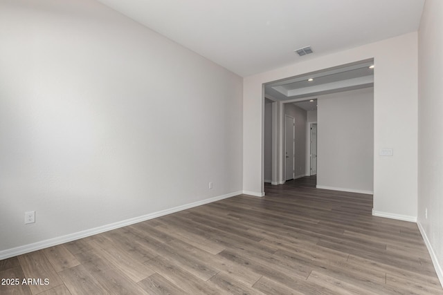 unfurnished room featuring wood-type flooring