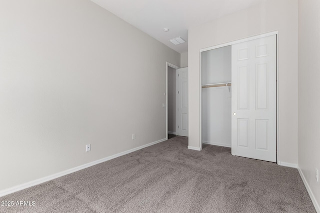 unfurnished bedroom with a closet and carpet