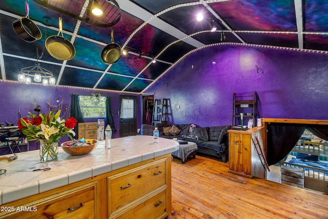 1326 W Apache Ln, Pinetop-Lakeside, AZ 85929 - kitchen featuring vaulted ceiling, light wood finished floors, and open floor plan