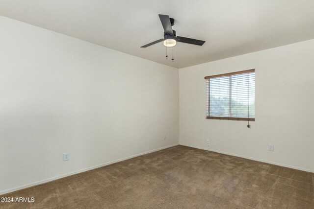 carpeted empty room with ceiling fan