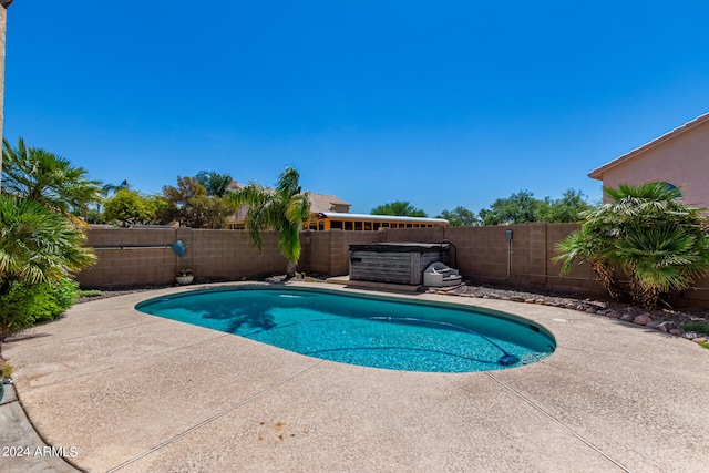 view of swimming pool with a patio area