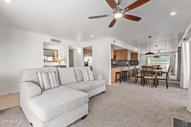 living room with visible vents, recessed lighting, ceiling fan, and ornamental molding