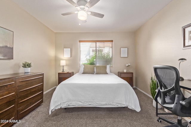 carpeted bedroom with ceiling fan and baseboards