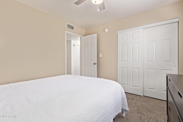 bedroom with light carpet, visible vents, ceiling fan, and a closet