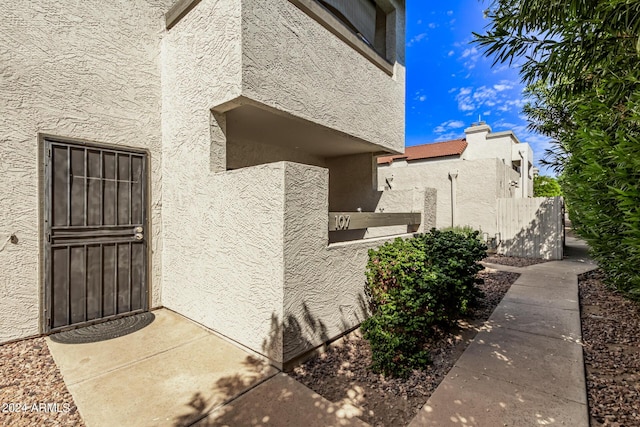 view of exterior entry featuring stucco siding