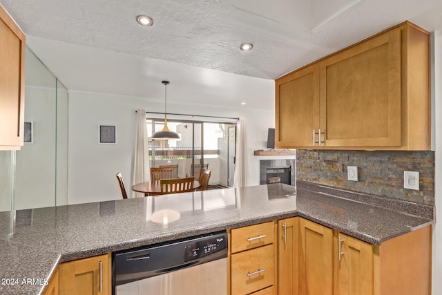 kitchen with a peninsula, dark stone counters, decorative backsplash, pendant lighting, and stainless steel dishwasher