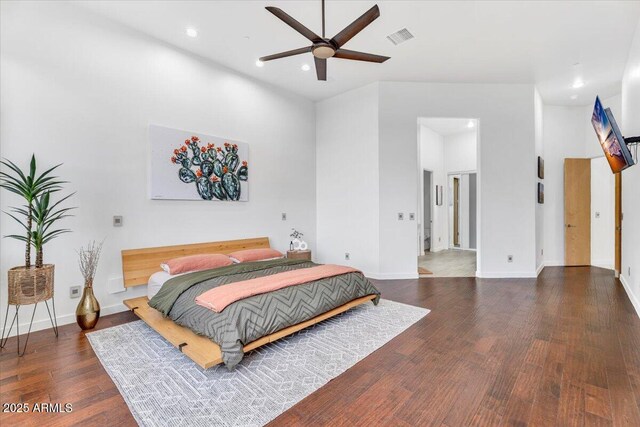 bedroom with visible vents, recessed lighting, baseboards, and wood finished floors