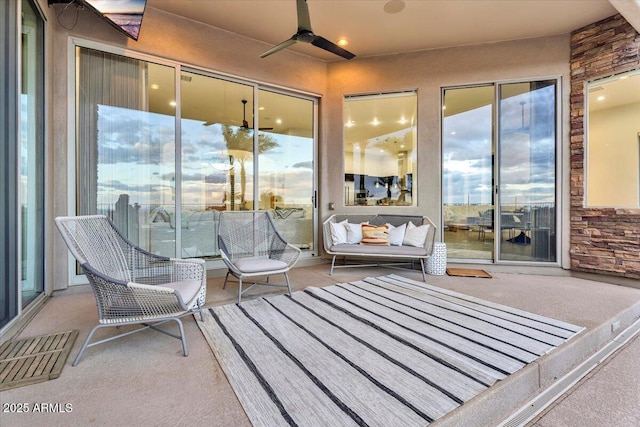 sunroom / solarium with ceiling fan