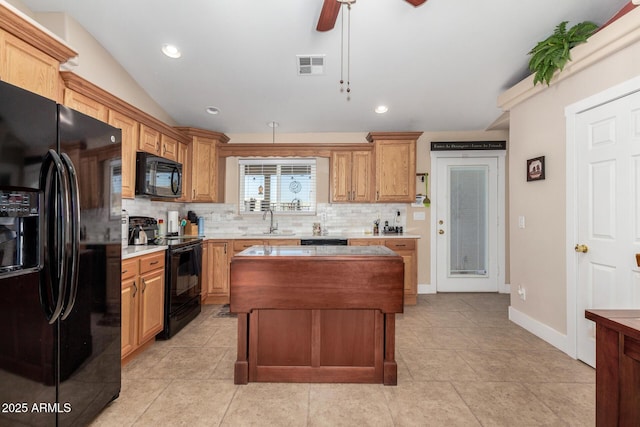 kitchen featuring vaulted ceiling, sink, backsplash, ceiling fan, and black appliances