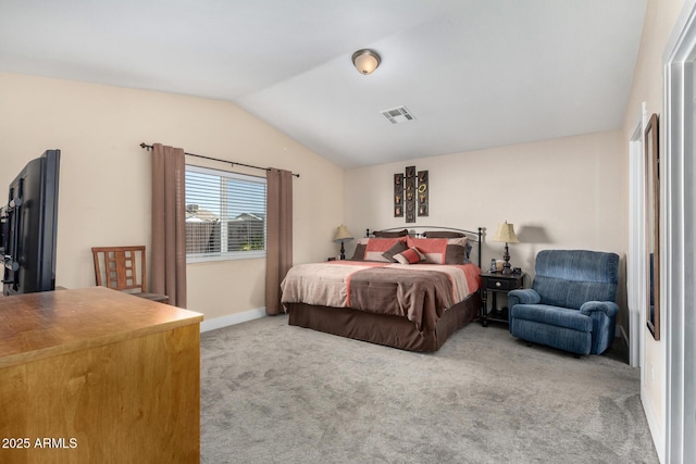 carpeted bedroom featuring lofted ceiling