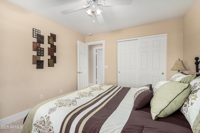 carpeted bedroom with a closet and ceiling fan