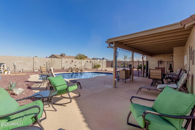 view of patio / terrace featuring a fenced in pool