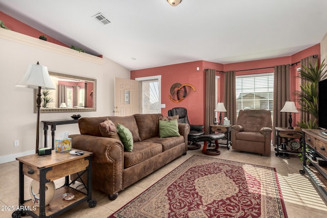 tiled living room with vaulted ceiling