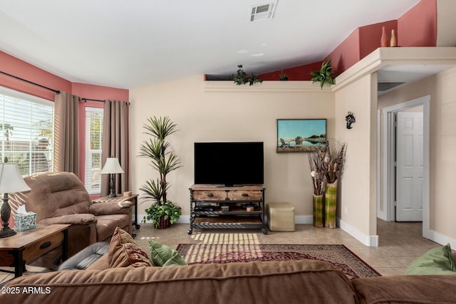 living room featuring light tile patterned floors and vaulted ceiling