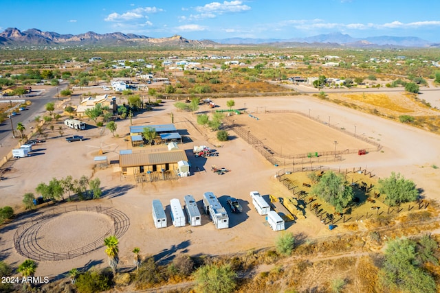 birds eye view of property with a mountain view