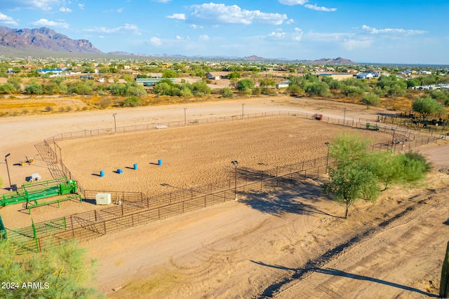 birds eye view of property with a mountain view and a rural view