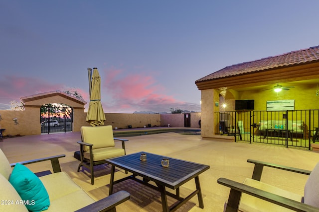 view of patio terrace at dusk