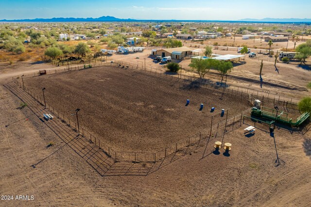 birds eye view of property with a mountain view