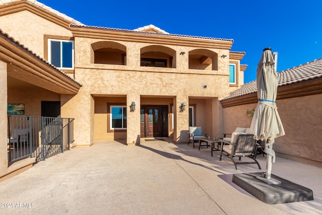 rear view of property with a patio area