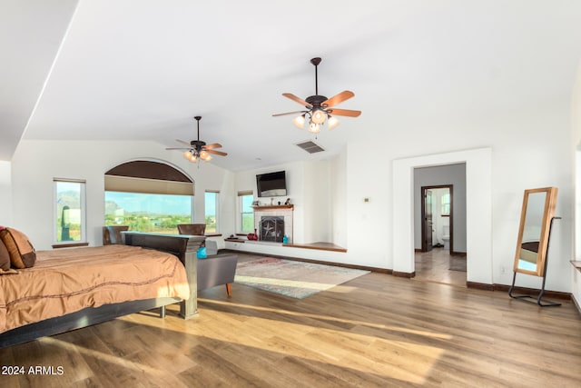 bedroom with lofted ceiling, ceiling fan, and hardwood / wood-style floors