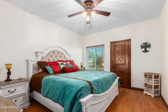 bedroom featuring ceiling fan and light hardwood / wood-style flooring