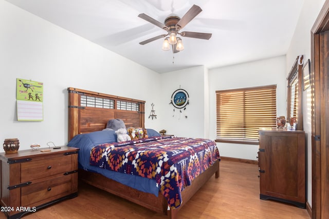 bedroom featuring light wood-type flooring and ceiling fan