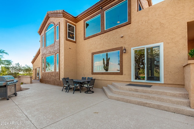 back of house with a patio