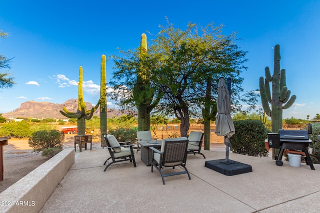 view of patio / terrace featuring area for grilling and a mountain view