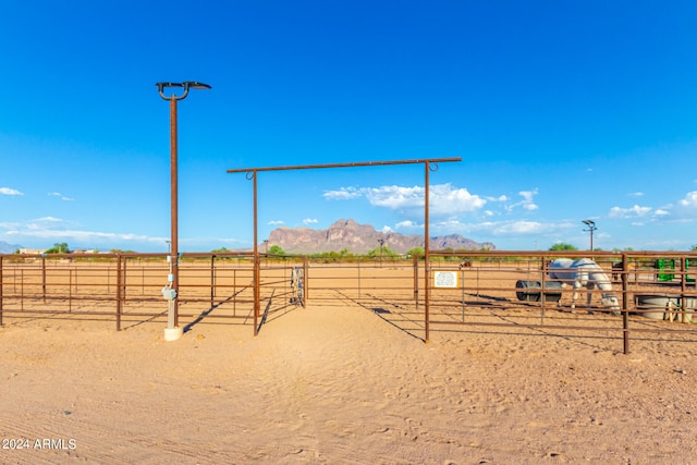 view of yard with a mountain view and a rural view