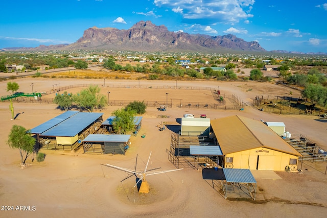 birds eye view of property with a mountain view