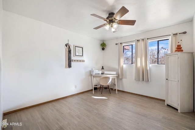 office featuring light wood-type flooring and ceiling fan