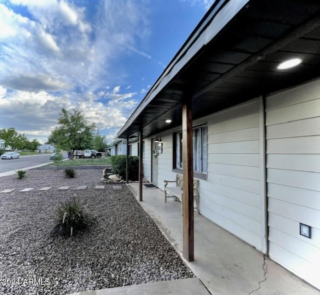 view of side of home featuring a patio