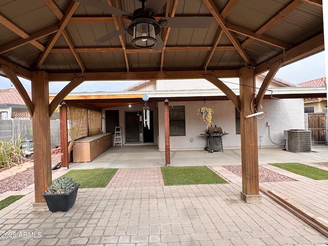 view of patio featuring a gazebo, central AC, ceiling fan, and grilling area