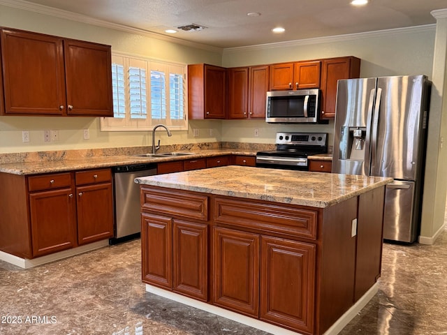 kitchen featuring appliances with stainless steel finishes, a center island, crown molding, and sink