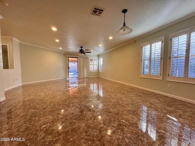 unfurnished room with ceiling fan, a textured ceiling, and ornamental molding