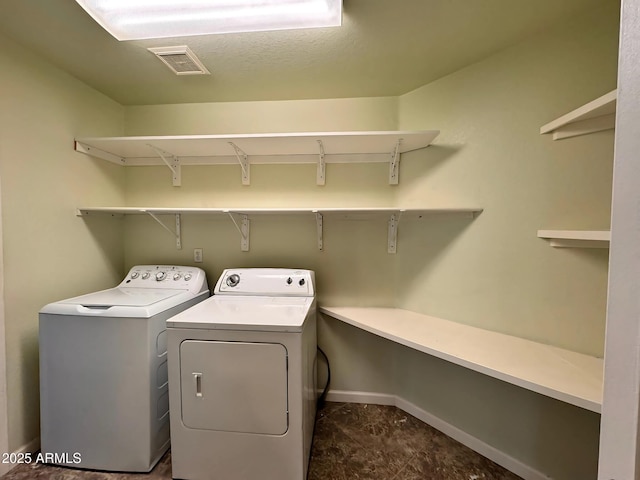 laundry room featuring independent washer and dryer